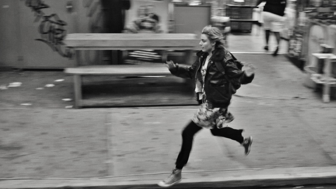 Frances running through the streets of Brooklyn
